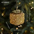 Golden gift box Christmas ornament with glitter and bow hanging on a festive tree - Gift Box Version