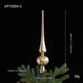 Champagne gold tree topper with snowflake pattern on green pine branches - Champagne
