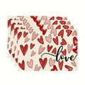 Primo piano di quattro tovagliette in lino con motivi a cuore rosso e scritta love - Stile Scritta Love (3)