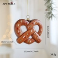 Festive brown pretzel gingerbread man Christmas tree hanging ornament decoration - Cookie Style