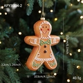 Brown gingerbread man Christmas tree hanging ornament with white icing and green bow - Gingerbread Man Style A