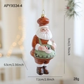Festive Santa Claus chef ornament in red with green apron and candy cane detail - Chef Style