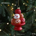 Adorno de torre de postre navideño rojo y blanco en una rama de árbol festivo - Helado Estilo B