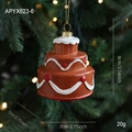 Three-layer chocolate cake Christmas ornament with festive white icing and red dots - Cake
