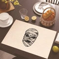 Linen placemat with black mummy print for Halloween table decor on dark wood - Mummy Head Print (Style 15)