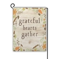 Macro view of linen Thanksgiving garden flag with grateful hearts gather quote and autumn leaves - Grateful Hearts Gather Design