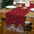 Close-up of a festive red linen table runner with white snowflakes and snowman patterns - 33*183cm / Red Snowman Tree and Squirrel (Style 18)
