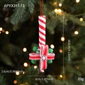 Christmas candy cane ornament with red white stripes and green berry bow detail - Scepter Style