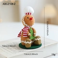 Christmas gingerbread man doll with chef hat and mini tree on green base ornament - Gingerbread Man With Chef Hat