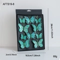 Set di 9 farfalle decorative glitterate verde acqua con clip per albero di Natale - Farfalla Ciano
