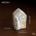 White ceramic house lamp with star cut-outs and Santa relief in warm glowing light - Ceramic Ornament Style B(ABCZ100-2)