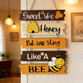 Detail of wooden bee welcome sign with five connected plaques and rustic jute rope - Bee Day Hanging Sign Model A (Sweet like Honey)