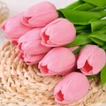Bouquet of pink PU artificial tulips with green leaves on a woven grass mat - Pink