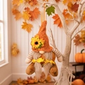 Fall gnome plush ornament with orange knit hat, sunflower accent, and long grey beard - Female Scarecrow Gnome