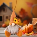Plush Thanksgiving gnome with orange knitted hat and sunflower detail on autumn background - Knitted Hat Bearded Style