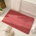 Plush coral red rectangle bath mat with vertical stripes on high-density absorbent fabric - Coral
