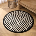 Modern black and white geometric round carpet on wooden floor in minimalist living room - Ascending Steps Pattern Round / Small