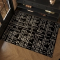 Modern black and white checkered entryway rug on a rustic herringbone wood floor - 50x80cm / Black and White Grid (Wei Lu)