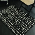 French luxury minimalist black and white woven rug with pixelated pattern in home setting - 50x80cm / Pine Snow