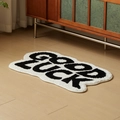 Cloud-shaped Good Luck tufted floor mat in minimalist black and white for home decor - 50x80cm