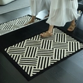 Luxurious black and white geometric striped doormat with thick faux wool texture - Geometric Steps