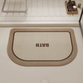 Semicircular beige linen bathroom mat with brown BATH text and absorbent texture - 40*60cm