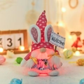 Pink Easter gnome plush with glowing belly and Welcome sign in a warm bokeh scene - Welcome Sign Style / Female Style Pink Hat