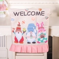 Easter gnome chair cover with pink polka dot ruffle and Welcome text for party decor - Three Gnomes Style