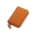 Detail of genuine brown leather wallet showing high-quality lychee texture and metal zipper - Caramel color