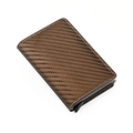 Detailed close-up of brown carbon fiber texture and stitching on an automatic card holder - Carbon Fiber Bronze