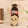 Brown knit gnome doll holding a coffee cup on wood base with a warm background - Style A Coffee Cup Gnome Ornament (W-QT-A)