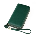 Detailed macro view of dark green pebbled leather texture with gold zipper hardware - Dark Green