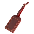 Macro view of vintage burgundy crazy horse leather luggage tag with double stitching - Red