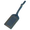 Detail of dark blue leather luggage tag with orange contrast stitching and bronze buckle - Blue