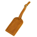 Macro detail of brown leather luggage tag with yellow stitching and bronze buckle - Brown