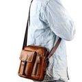 Brown vintage genuine leather crossbody bag for men showing vertical casual style and texture - Brown