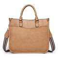 Detail view of vintage camel tote bag featuring lychee texture and striped woven strap - Khaki