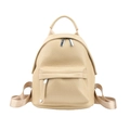 Detail showing the lychee grain texture and silver metal zippers of this mini backpack - Khaki