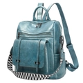 Macro view of teal blue PU leather backpack with vintage texture and woven strap - Grey Blue
