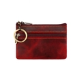 Detail of dark red vintage genuine leather coin purse with yellow stitching and key ring - Red
