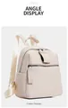 Detail of off-white lychee grain leather mini backpack with dual front zipper pockets - Off-white