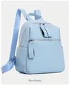 Detail of light blue PU leather backpack with silver zippers and side pockets - Blue
