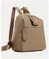 Detail of khaki PU leather backpack showing fine lychee grain texture and front zipper pocket - Khaki