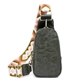 Close-up of vintage dark green leather texture and colorful geometric woven strap - Green