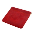 Detail of red crazy horse leather coin purse with orange hand-stitched seams and metal snap - Red