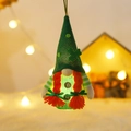 Light-up St. Patrick's Day gnome ornament with green mesh hat and orange braids - Female (Braids)