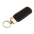 Detail of vintage crazy horse leather keychain with orange stitching and bronze hardware - Black