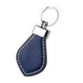 Detail of dark blue lychee grain leather keychain with white contrast stitching and silver ring - Sapphire Blue