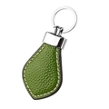 Detailed view of green lychee leather keychain with white stitching and silver metal ring - Grass Green