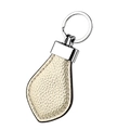 Detailed view of champagne leather teardrop keychain with polished silver metal ring - Gold